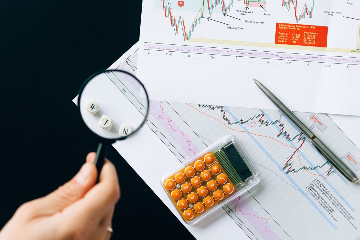 Lunar Detectives analyst tracing stolen funds across bank accounts and blockchain wallets on a screen