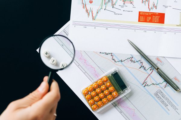 Lunar Detectives analyst tracing stolen funds across bank accounts and blockchain wallets on a screen